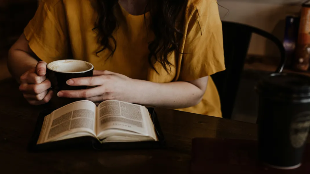Picture depicting a woman reading a book, and it's depicting why women love true crime 