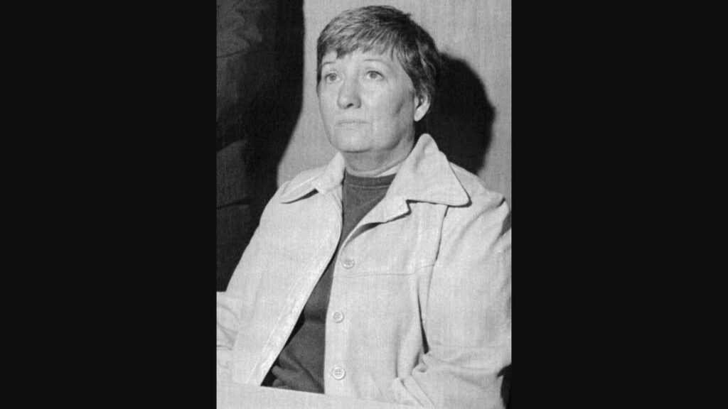 How did Bonnie Nettles die ? This section shows a black-and-white archival photograph of Heaven's Gate co-founder Bonnie Nettles with short dark hair wearing a buttoned coat